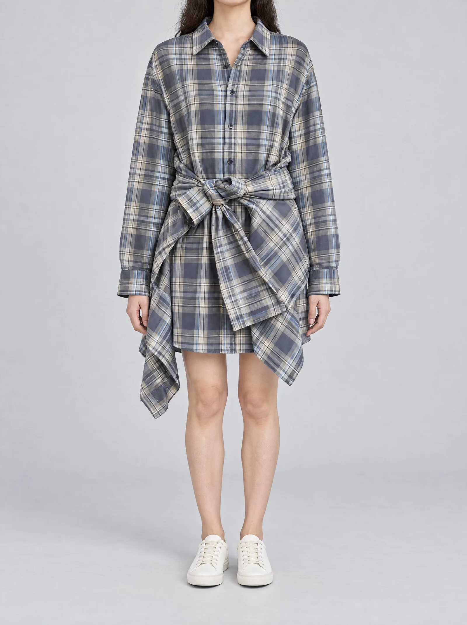 The same shirt dress worn by a person, the frame cropped at the jaw so no face is visible